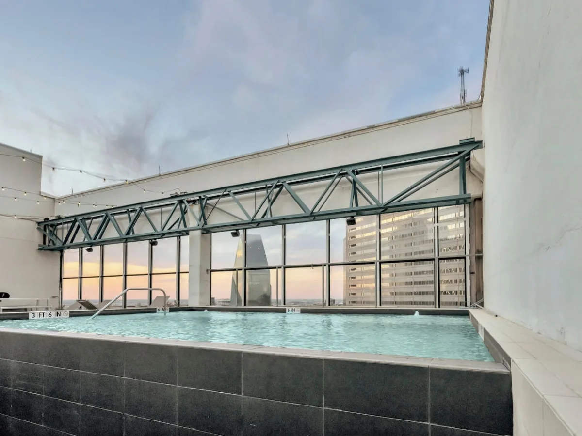 You can imagine yourself lounging by the pool, surrounded by greenery and the gentle sound of water.