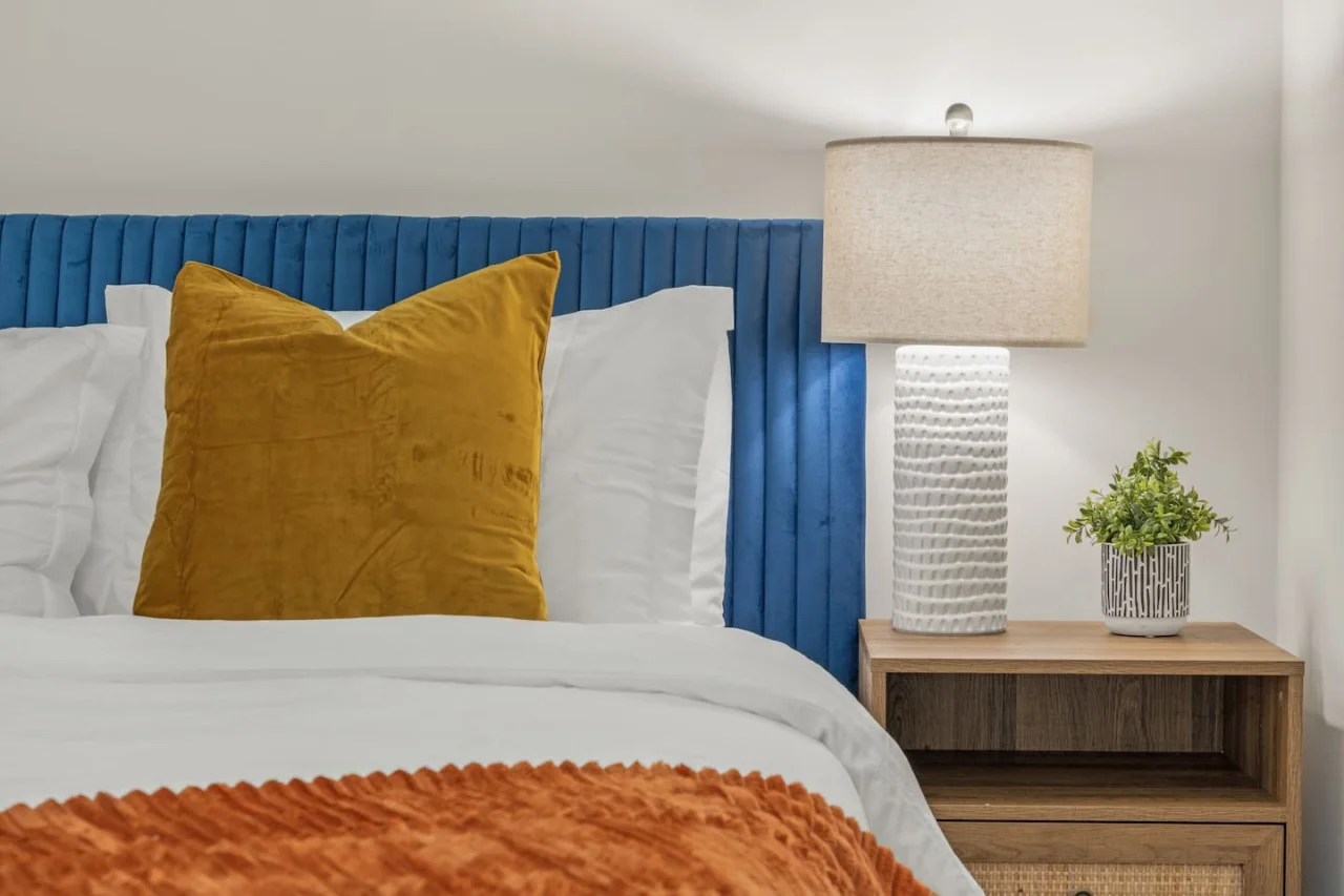 The bedroom’s serene ambiance invites you to relax, with a plush bed that promises a restful night's sleep.