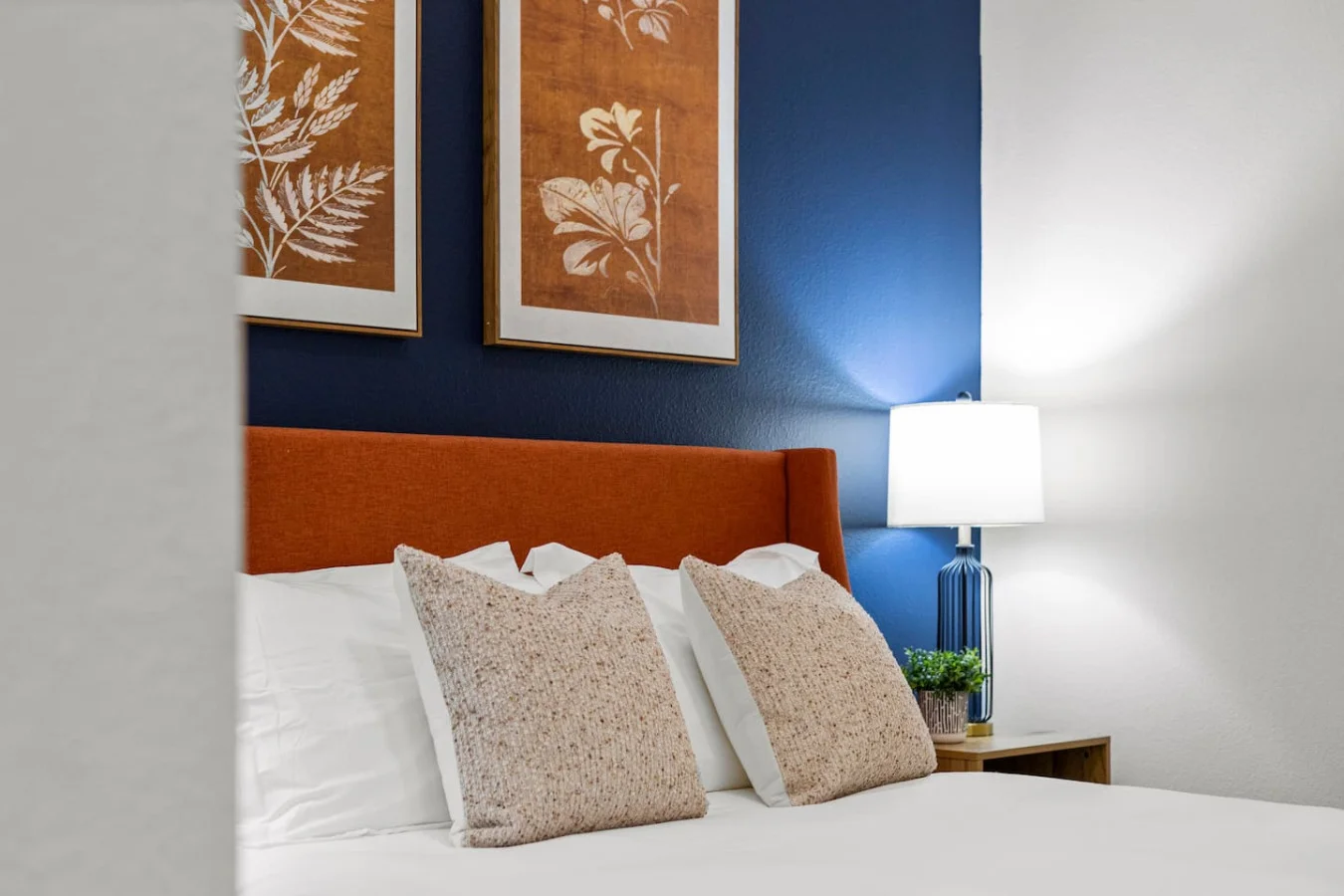 You feel enveloped in comfort as you relax on the queen bed, surrounded by a room designed for tranquility.
