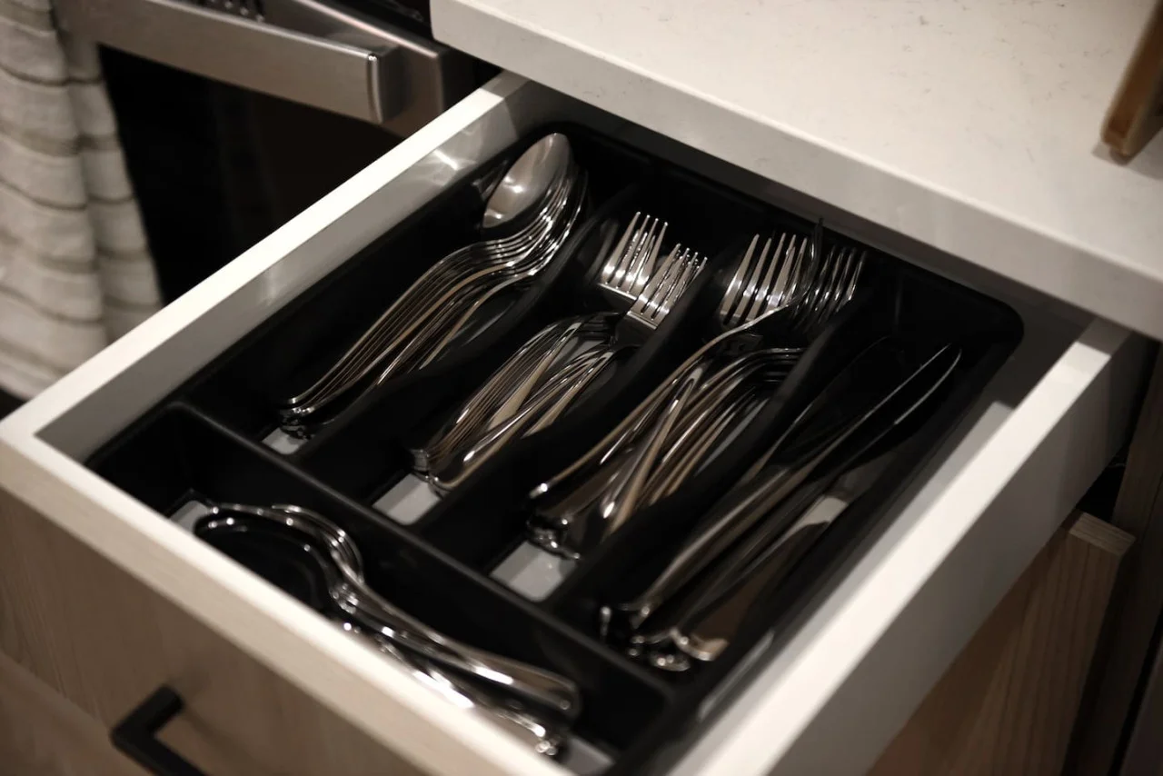 Kitchen cabinets stocked with cooking wares, glassware and silverwares, ideal for mixing up your favorite meals and drinks during your stay.