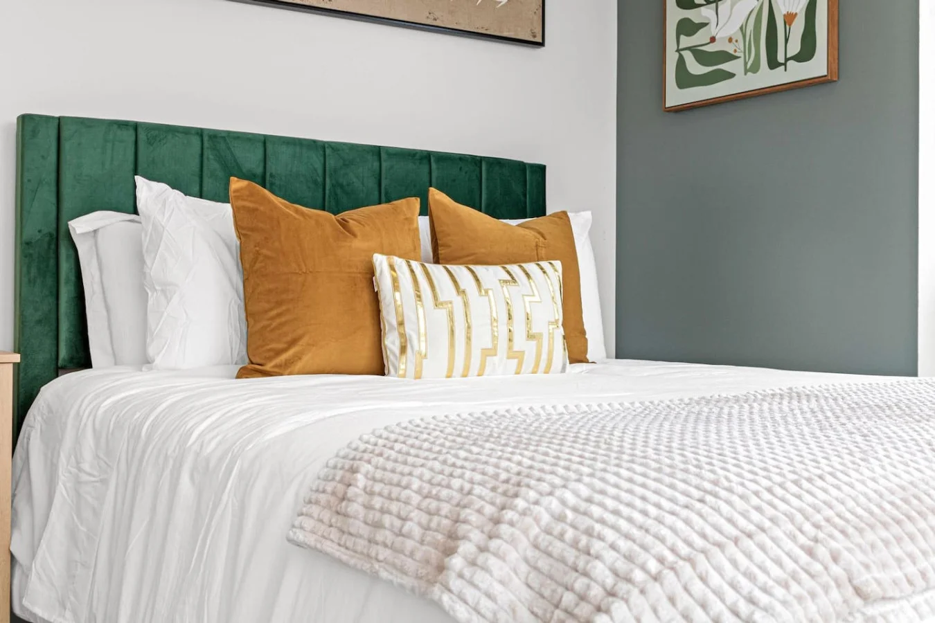 You feel enveloped in comfort as you relax on the queen bed, surrounded by a room designed for tranquility.