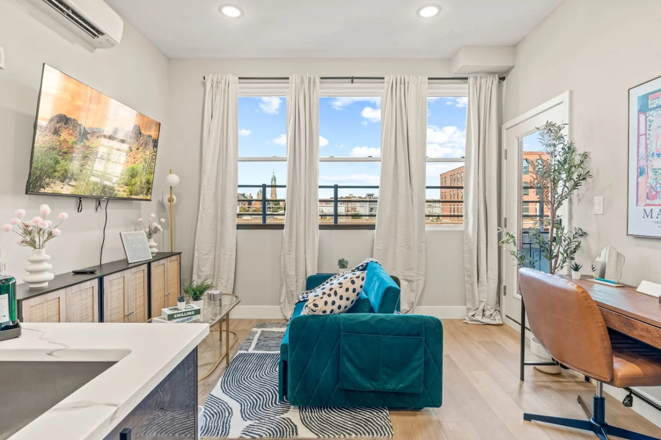 You feel a sense of peace as you step into the living room , with its inviting decor and soothing tones.