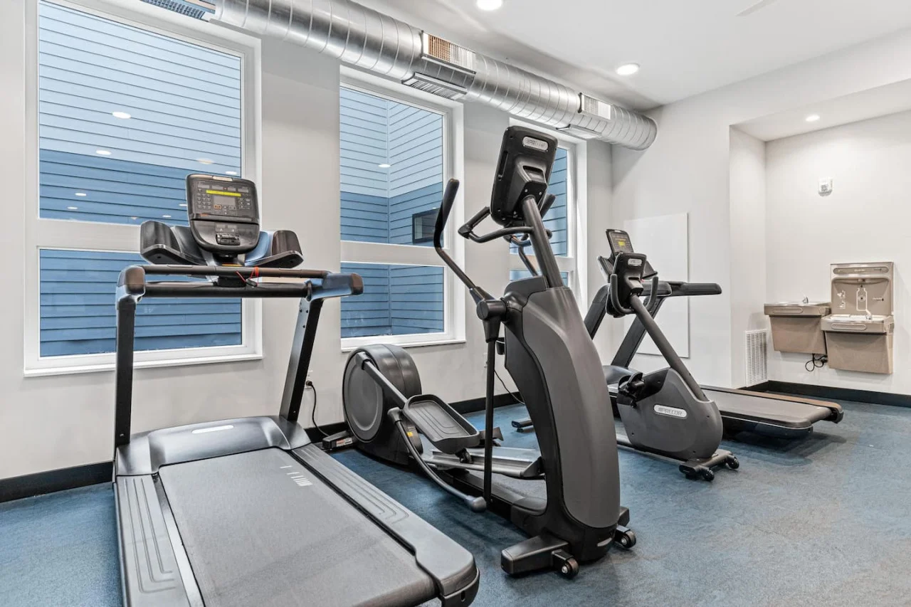 Dedicated space featuring a wide range of dumbbells, benches, and mirrors for strength and resistance training