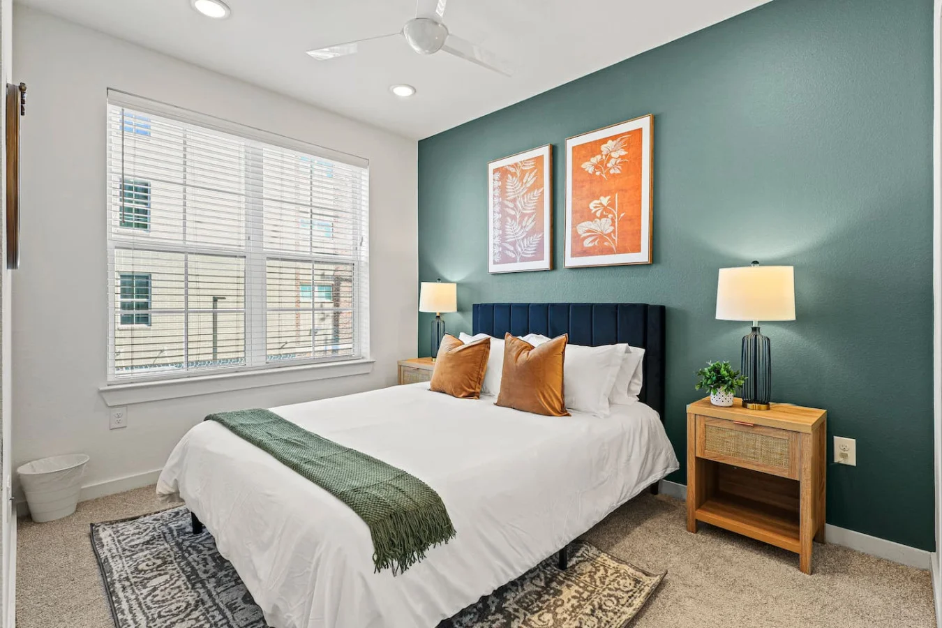You feel enveloped in comfort as you relax on the queen bed, surrounded by a room designed for tranquility.