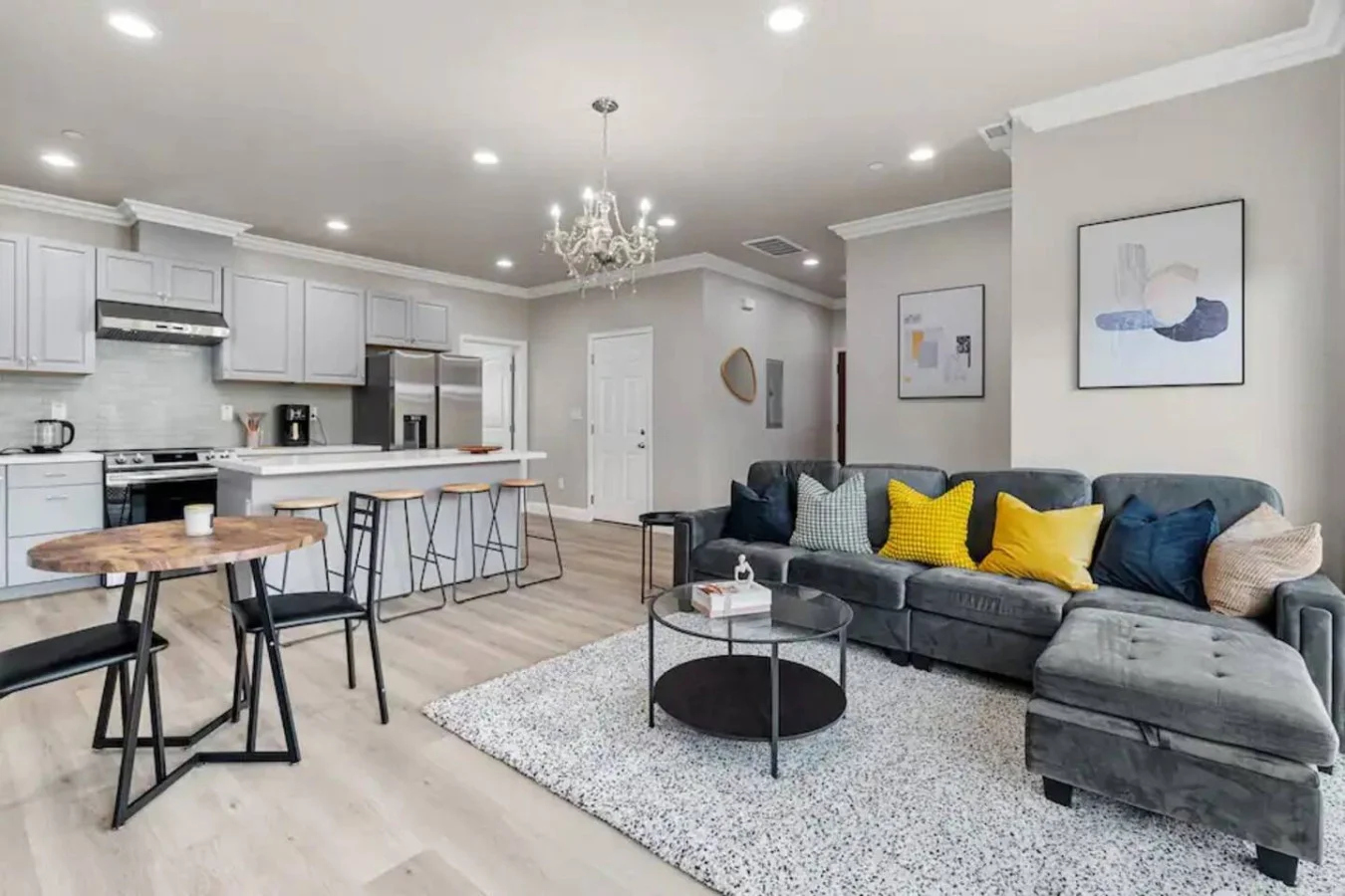 You feel at home as you settle into the living room, where the inviting atmosphere is perfect for lounging or entertaining.
