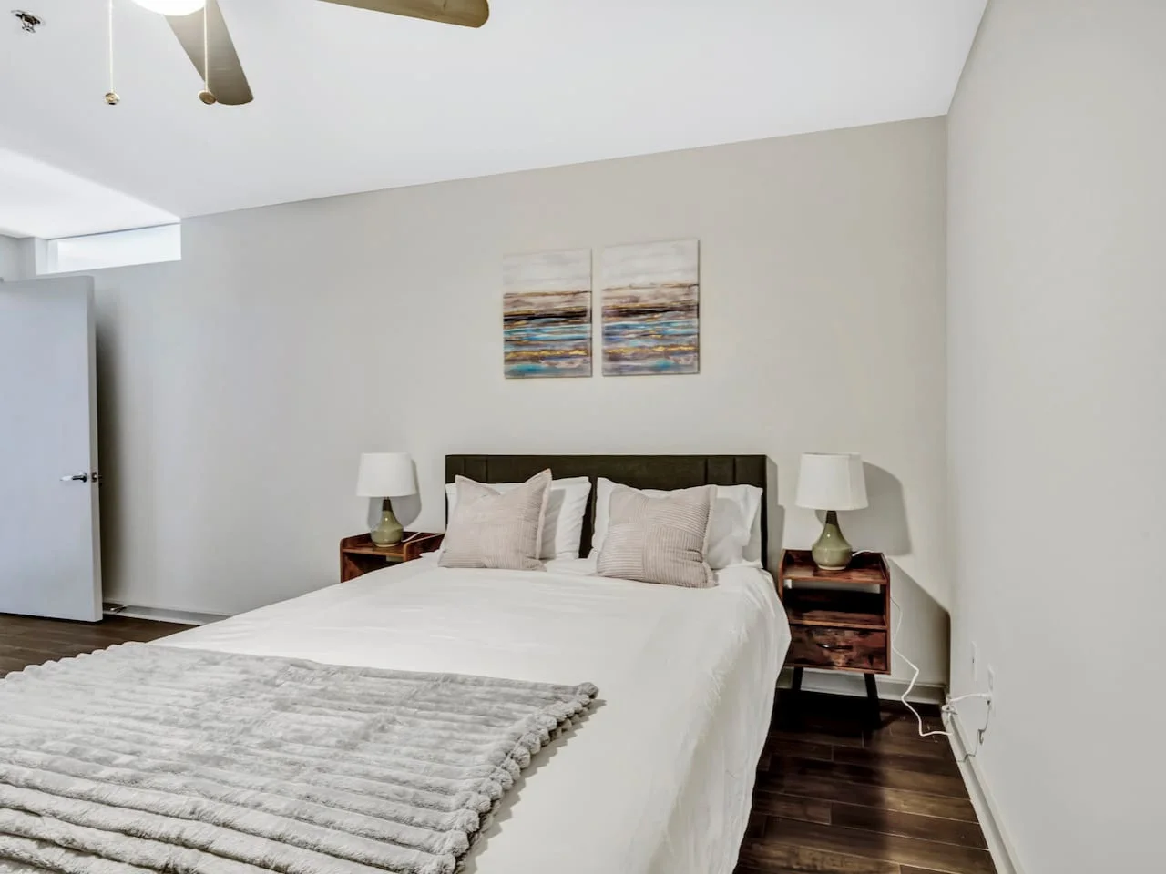 The bedroom’s serene ambiance invites you to relax, with a plush bed that promises a restful night's sleep.