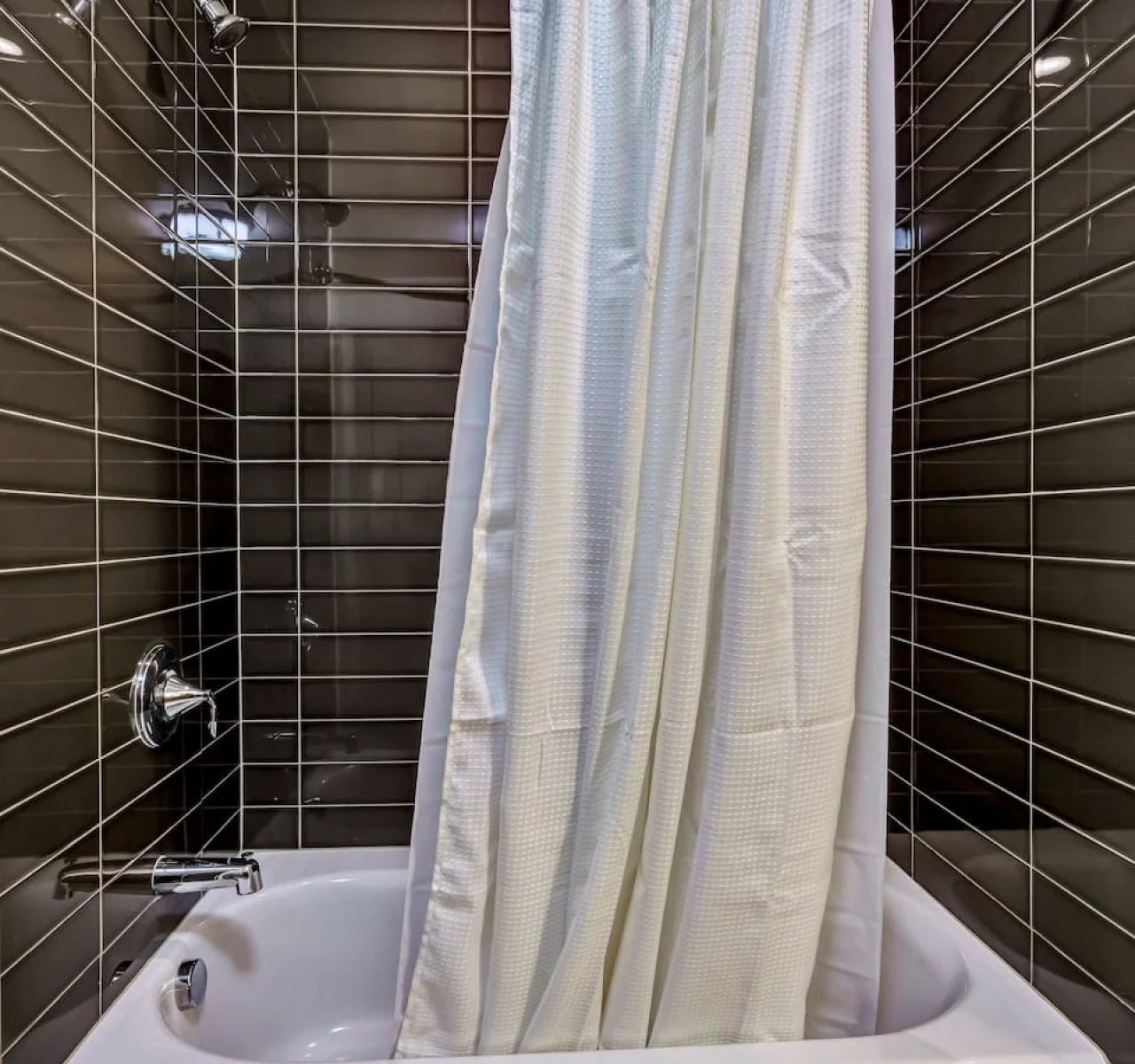 Step into this sparkling clean bathroom, offering you a refreshing retreat. Enjoy a hot shower surrounded by serene forest vibes, and wrap yourself in soft towels after a long day of exploring or relaxing.