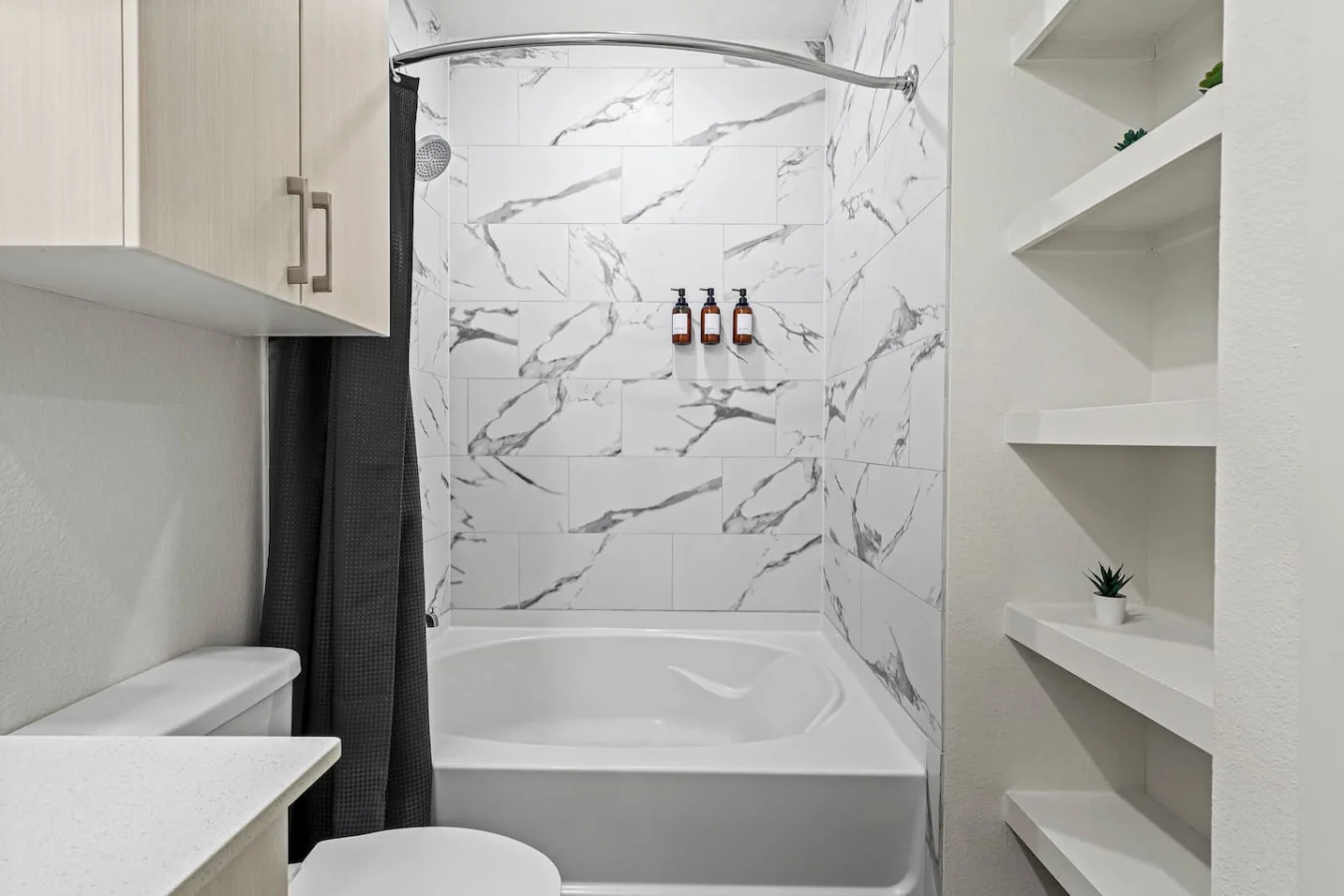 You feel a sense of calm as you enter the bathroom, where the thoughtful design and high-quality materials create a serene environment.