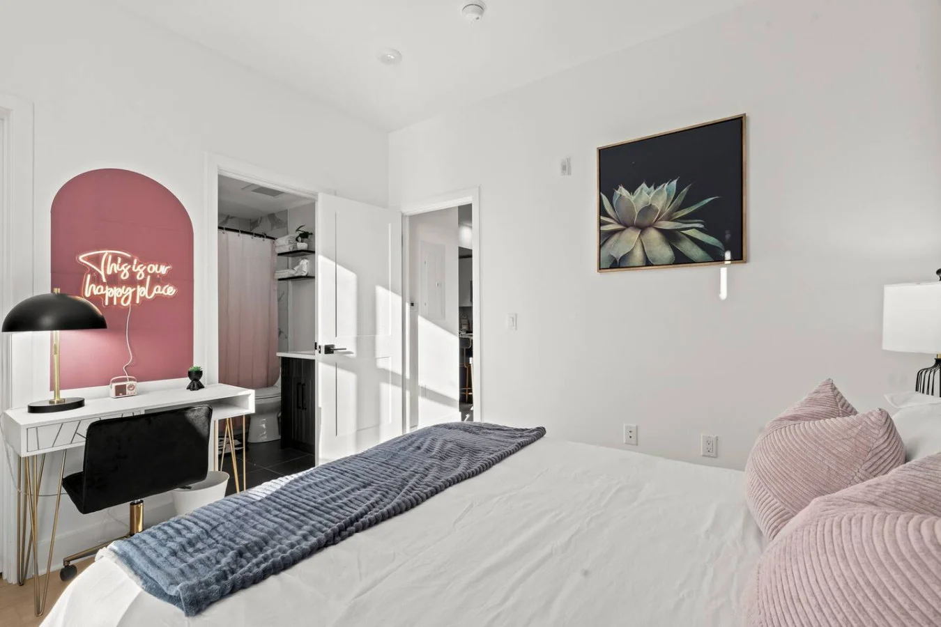 Spacious master bedroom with direct access to your private bathroom, closet, and dedicated workspace.