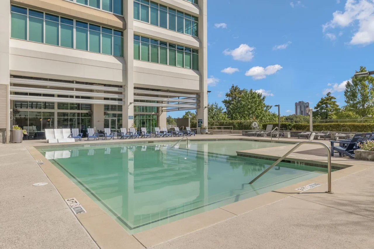 You can imagine yourself lounging by the pool, surrounded by greenery and the gentle sound of water.