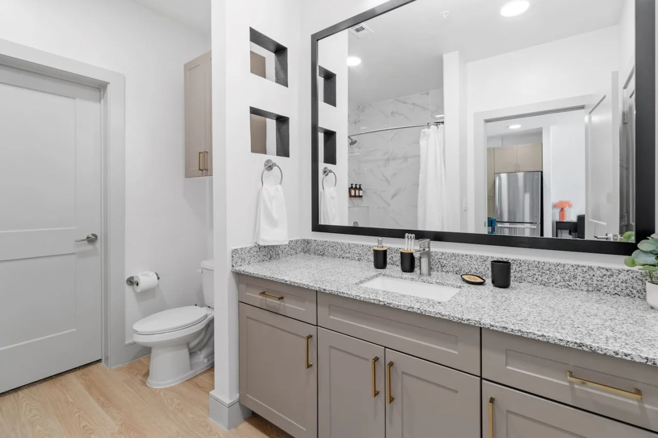 You feel a sense of calm as you enter the bathroom, where the thoughtful design and high-quality materials create a serene environment.