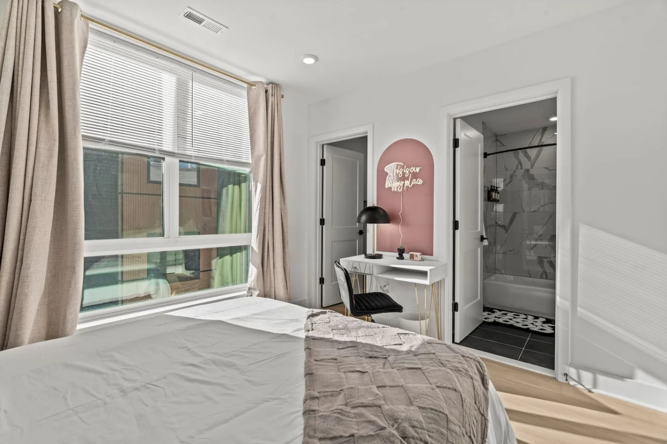 The bedroom’s serene ambiance invites you to relax, with a plush bed that promises a restful night's sleep.