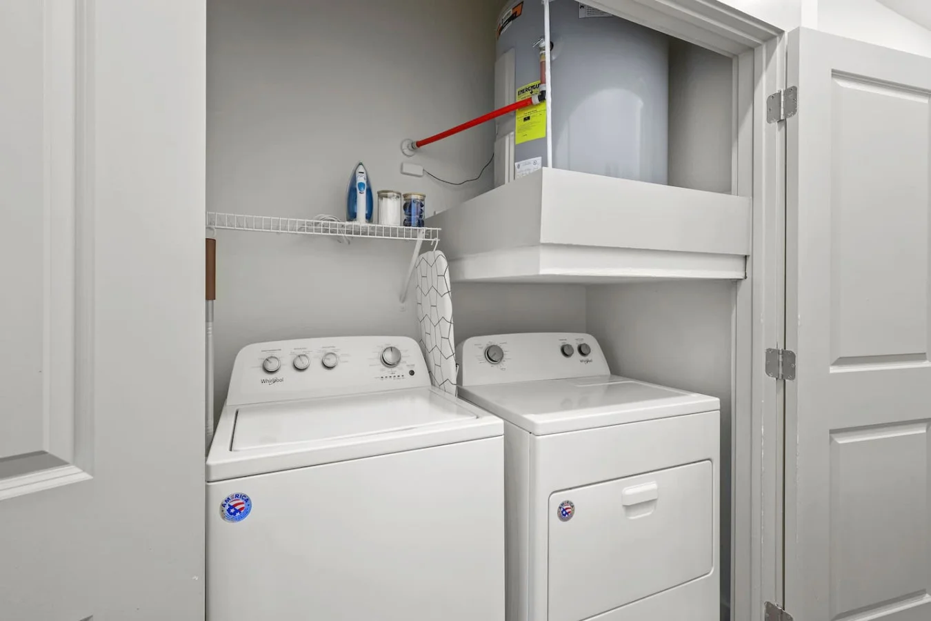 Convenient laundry room with washer, dryer, and all necessary supplies, making it easy to take care of your laundry needs.