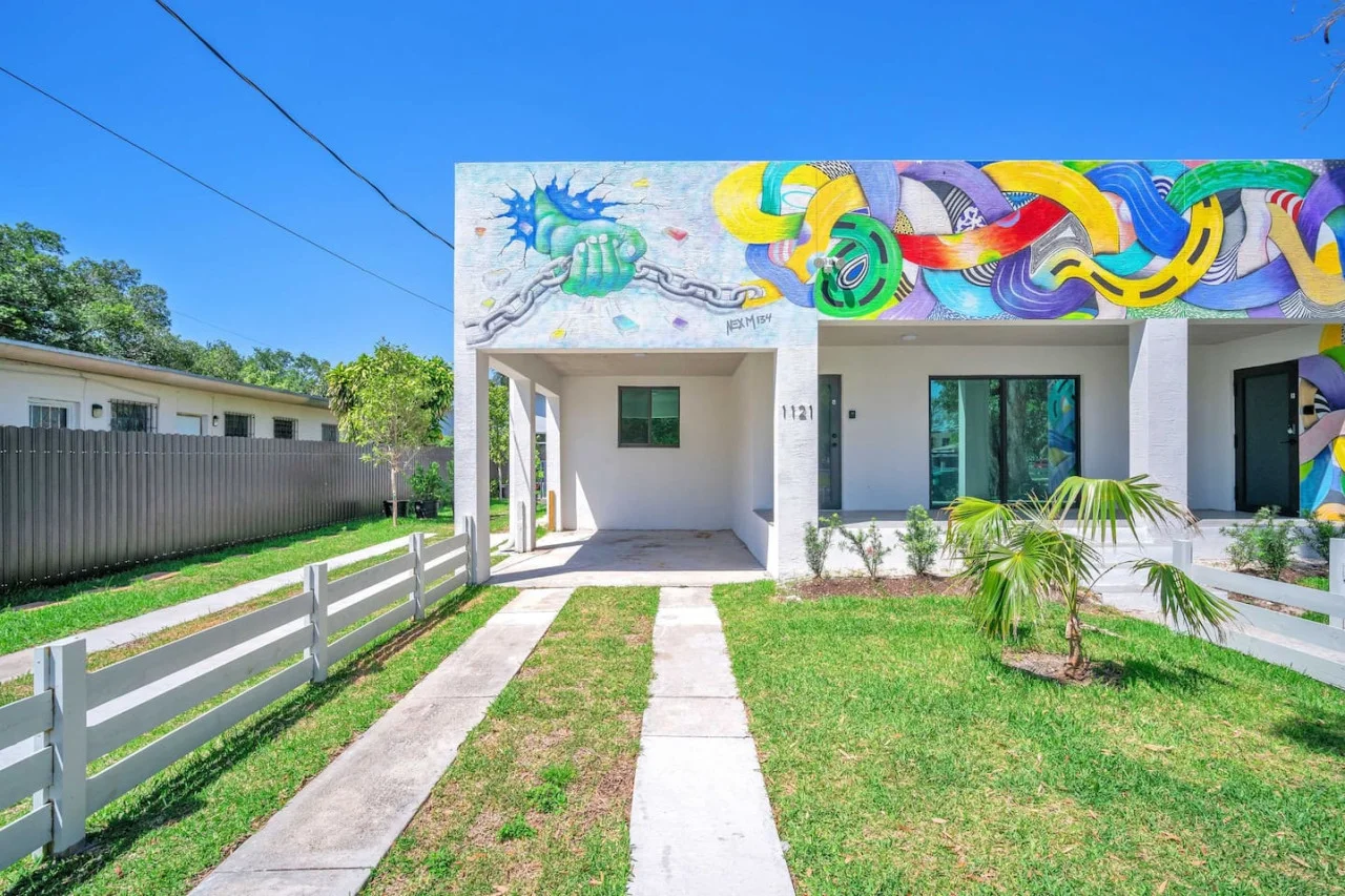 As you approach the house, the inviting entrance and beautiful exterior make you eager to explore what’s inside.