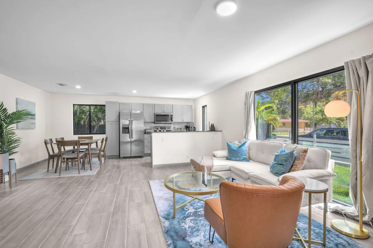 Wide view of the open-concept living and dining space, offering natural light and a seamless flow between areas.