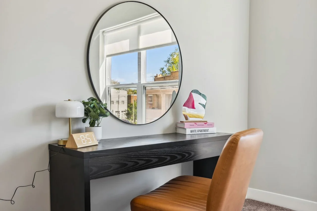 This cozy workspace with warm lighting, and a creative wall display, perfect for productivity.