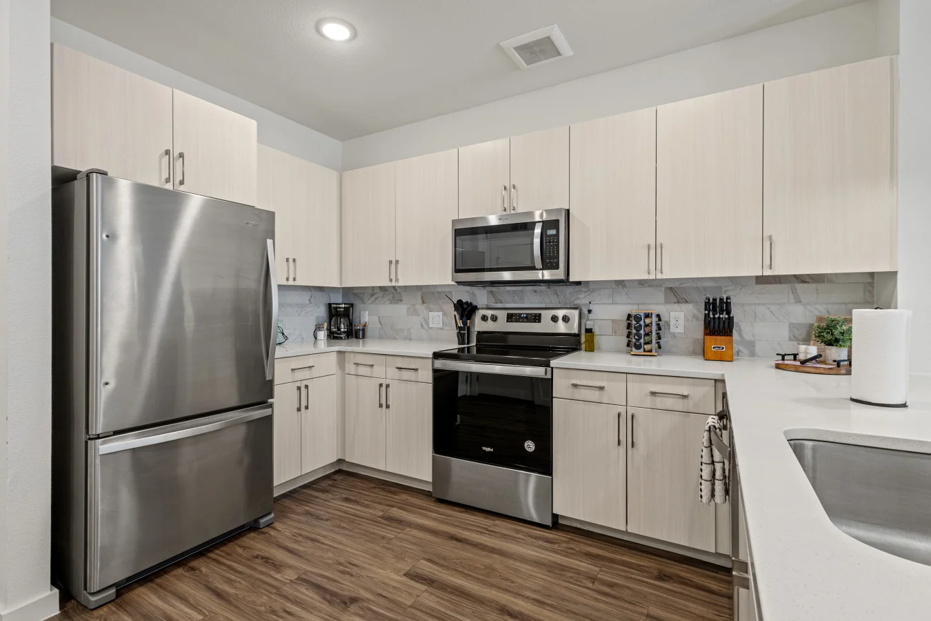 Cook with ease in our modern kitchen, featuring stainless steel appliances and all the essentials for a comfortable stay.