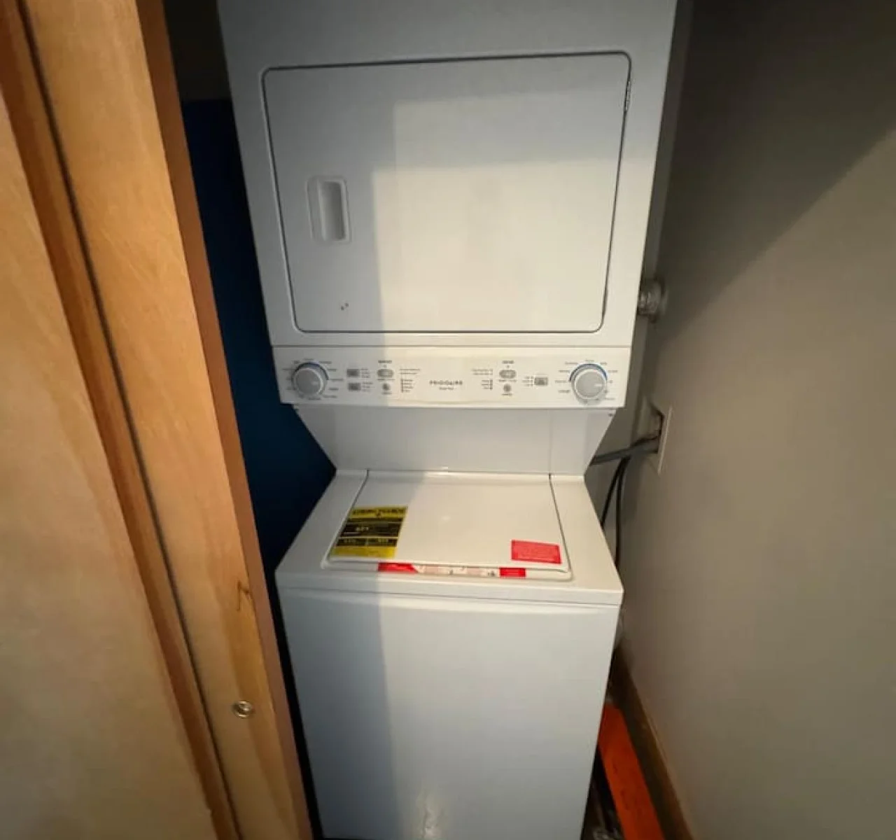 Laundry room with a washer, dryer, and folding area, offering all the convenience you need for a comfortable extended stay.