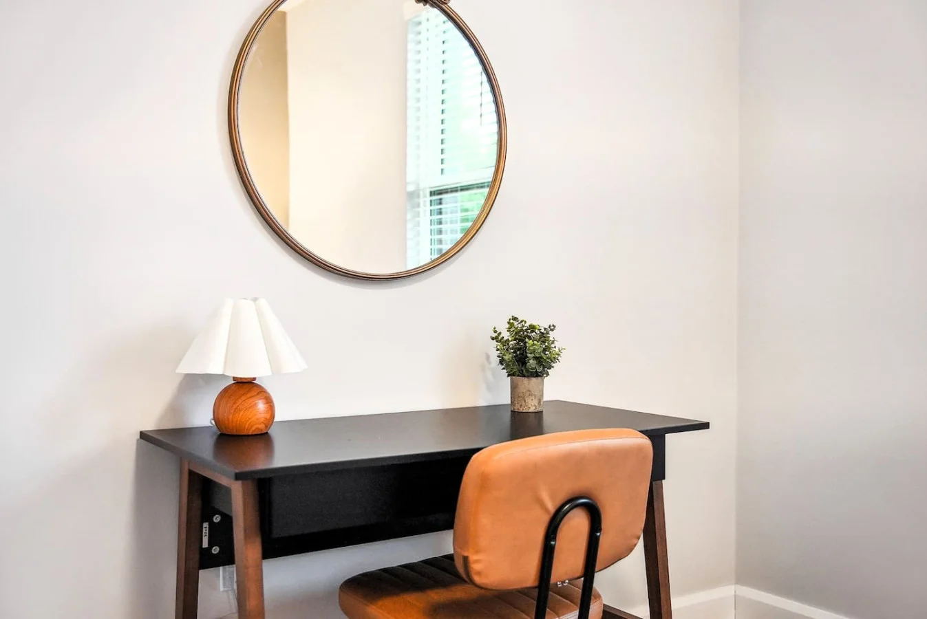 This cozy workspace area is perfect for productivity. Enjoy natural light, a comfortable chair, and a stylish desk setup. Ideal for work-from-home needs or planning your Dallas adventures.