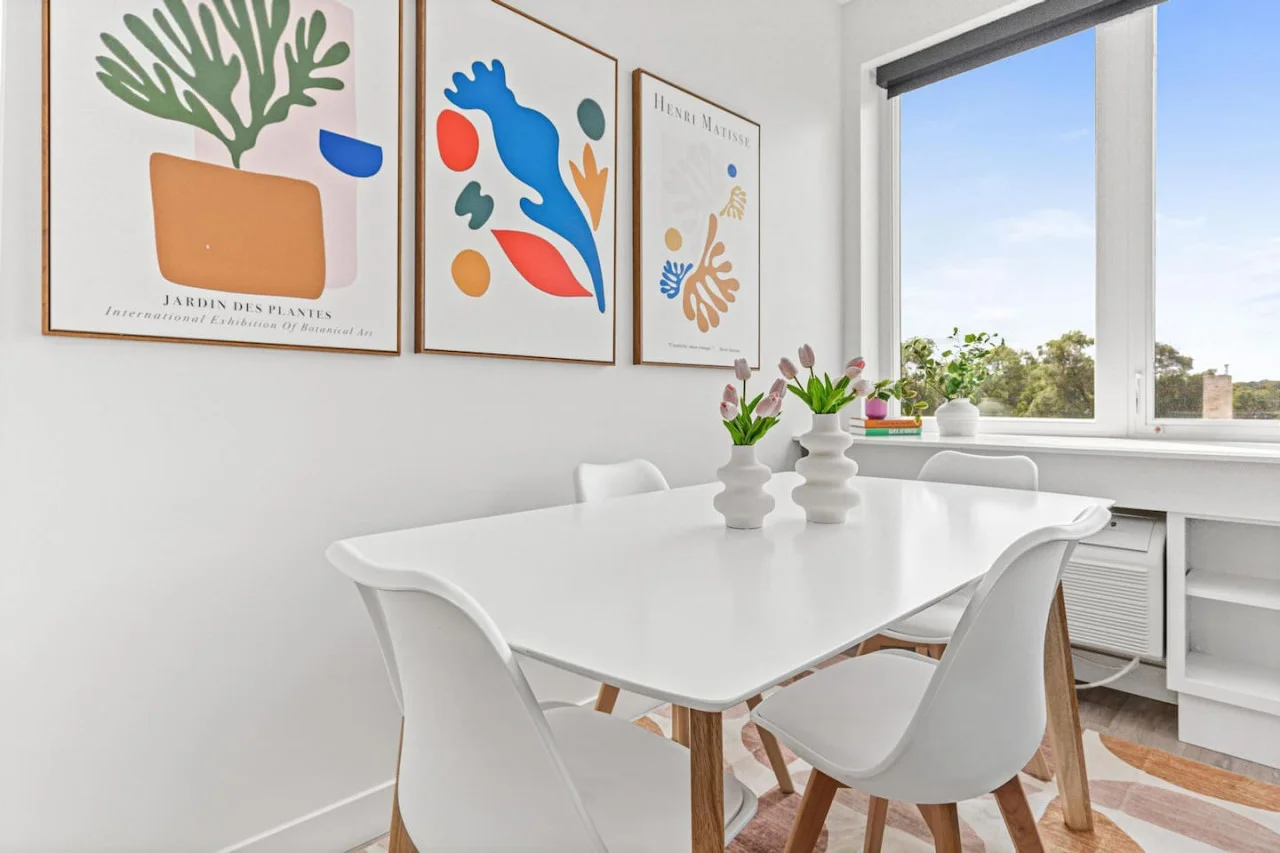 Elegant dining area with a large table and comfortable seating, perfect for gathering with family and friends for a meal.