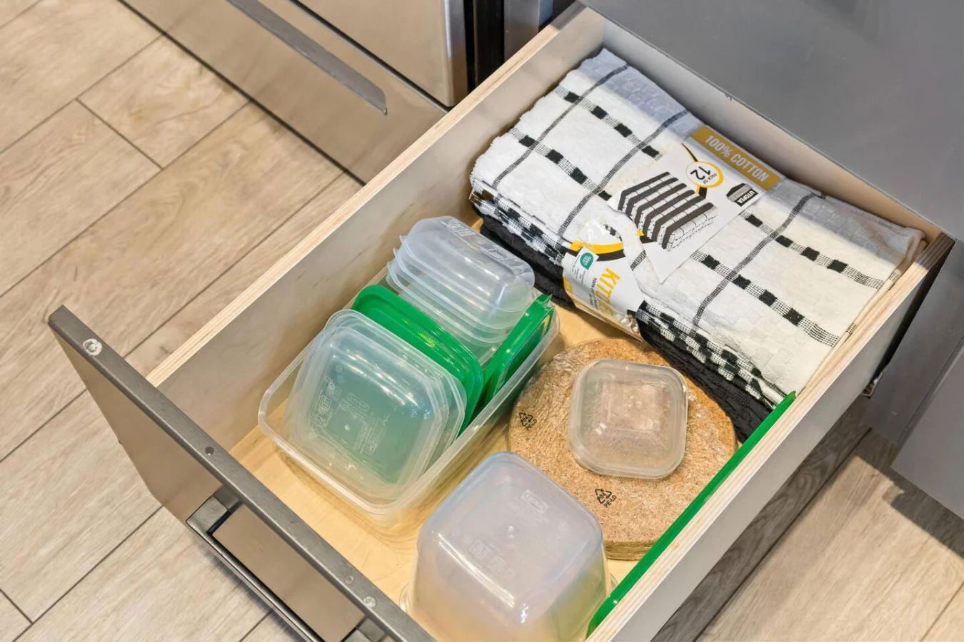 Kitchen cabinets stocked with cooking wares, glassware and silverwares, ideal for mixing up your favorite meals and drinks during your stay.
