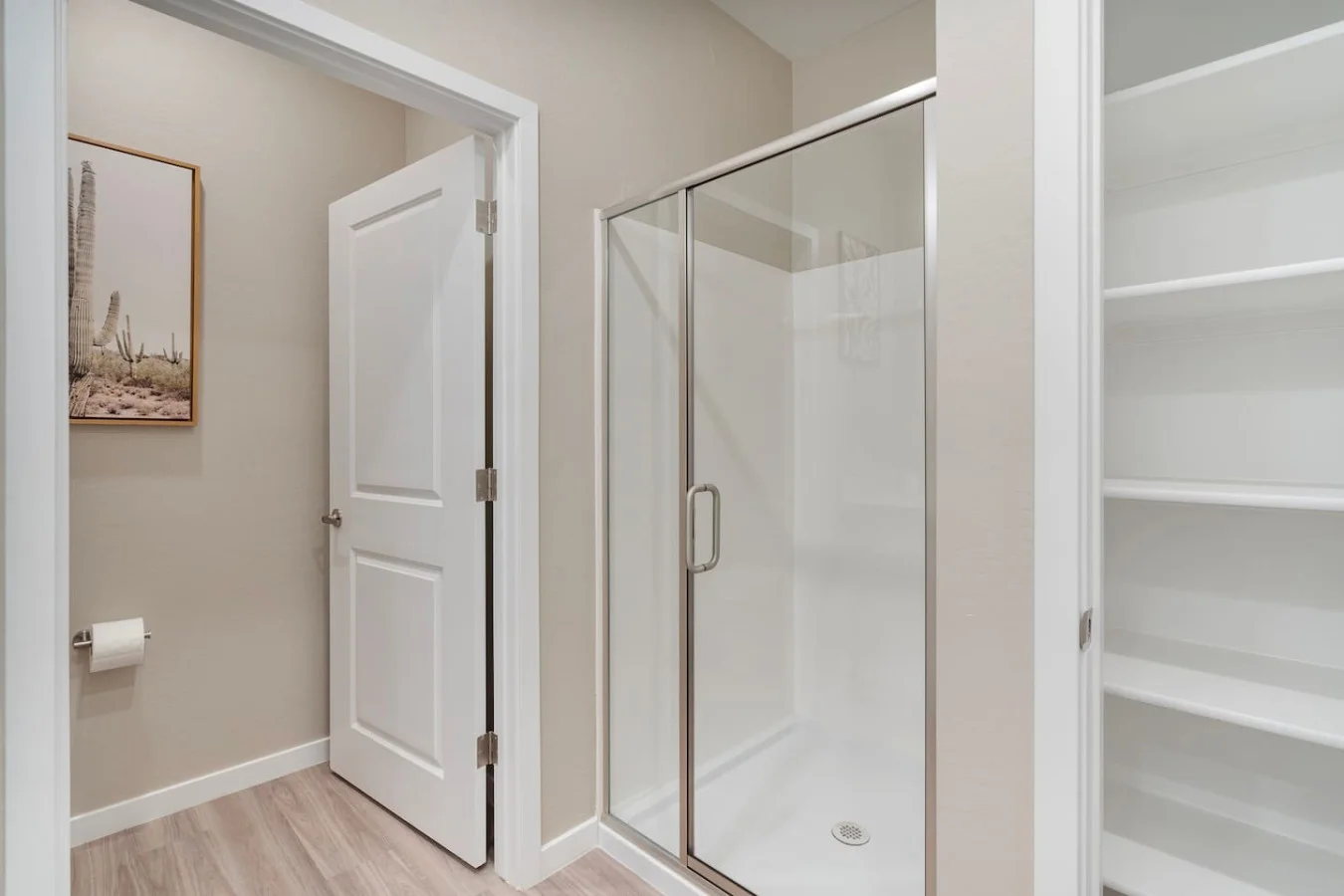 This bright and welcoming bathroom invites you to freshen up in comfort. Enjoy the forest-inspired shower curtain that adds a calming touch to your routine, complemented by the cozy rug underfoot and sparkling clean fixtures.
