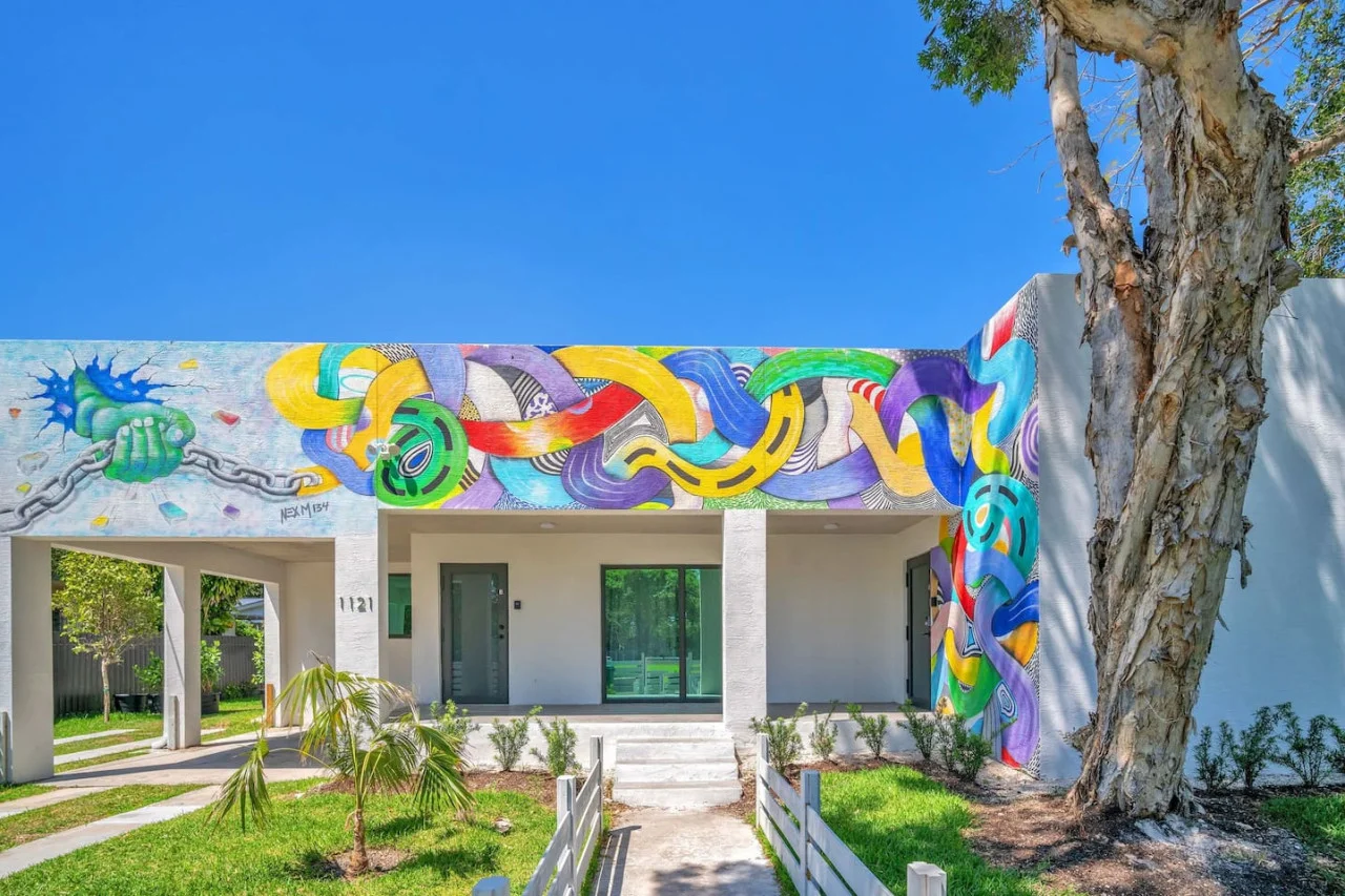As you approach the house, the inviting entrance and beautiful exterior make you eager to explore what’s inside.