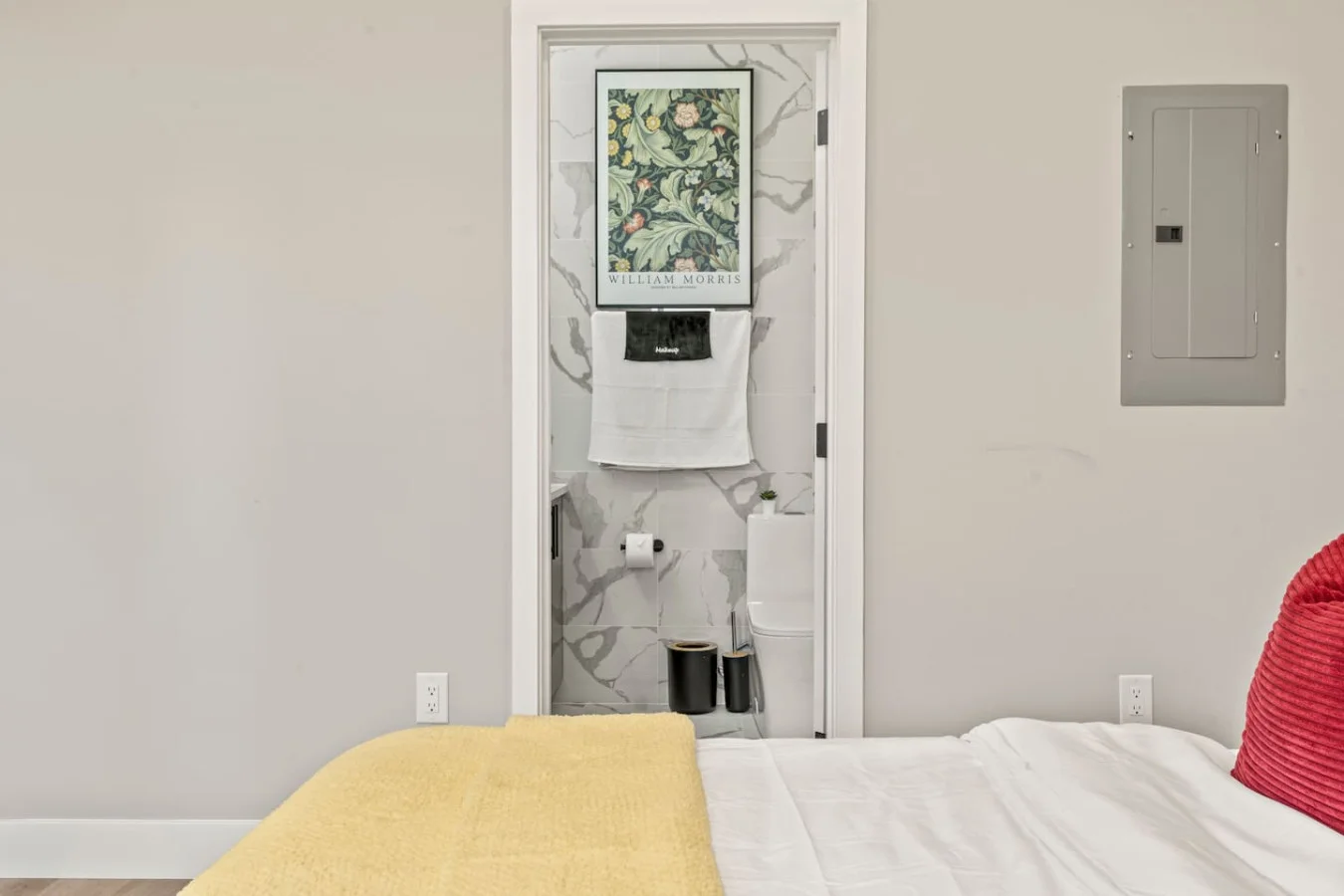 You feel enveloped in comfort as you relax on the queen bed, surrounded by a room designed for tranquility.