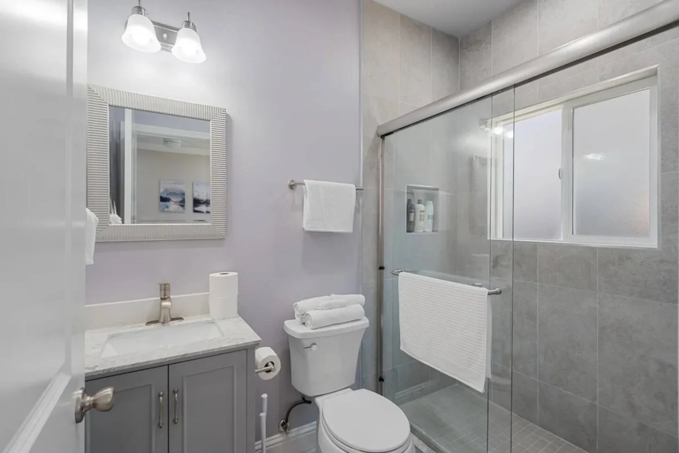 You feel a sense of calm as you enter the bathroom, where the thoughtful design and high-quality materials create a serene environment.