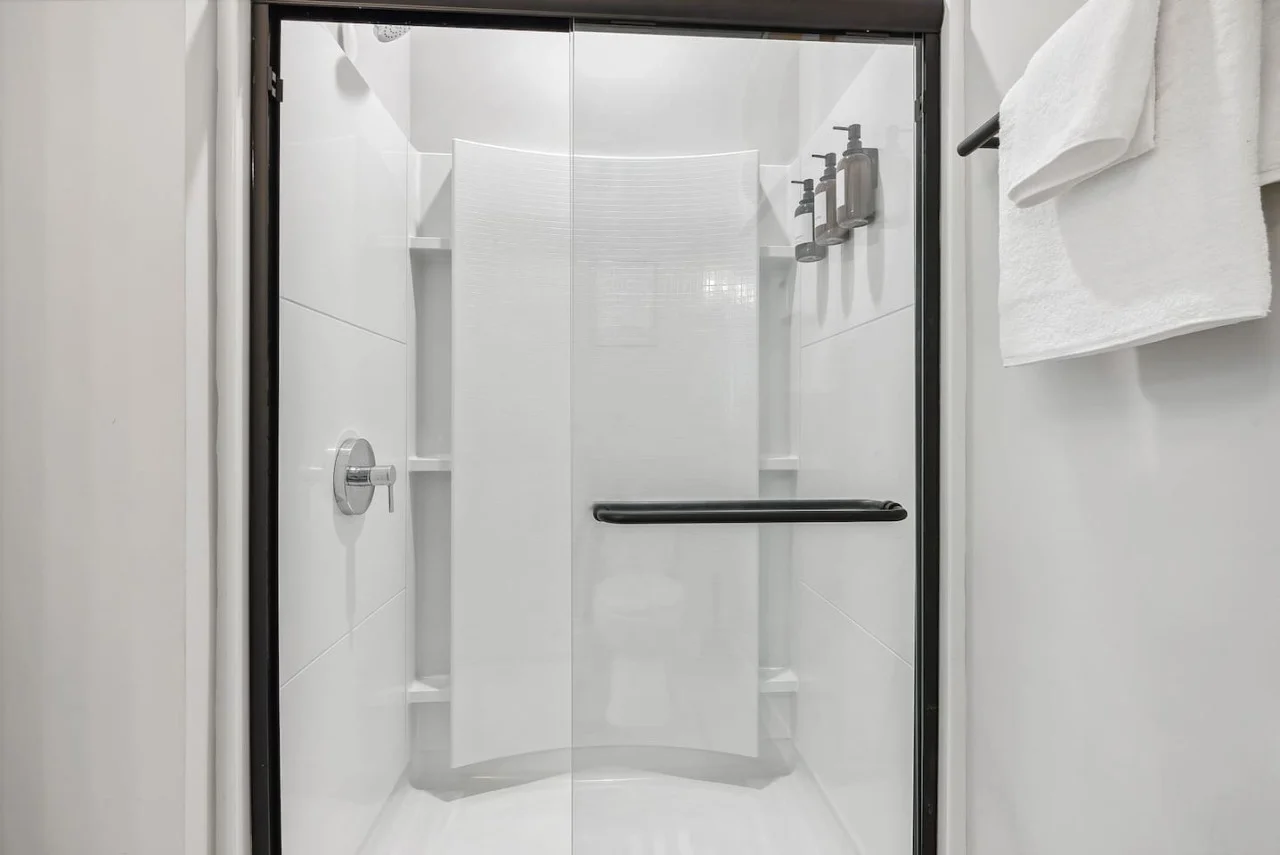 You feel a sense of calm as you enter the bathroom, where the thoughtful design and high-quality materials create a serene environment.