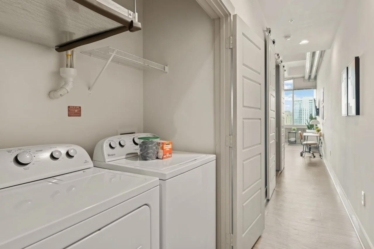 Convenient laundry room with washer, dryer, and all necessary supplies, making it easy to take care of your laundry needs.