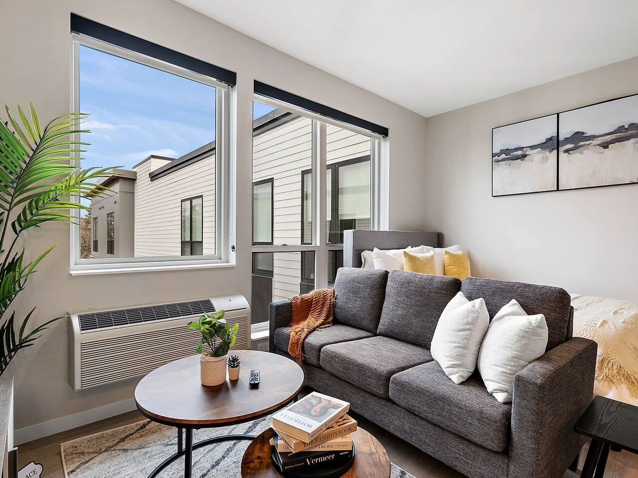 The living room is filled with natural light, creating a bright and welcoming space that invites relaxation.
