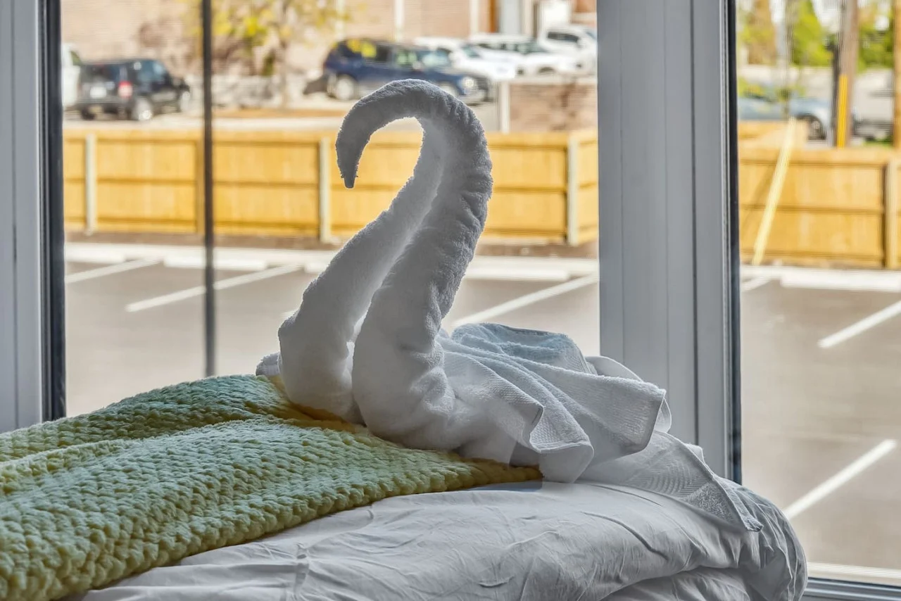 The king bed is the centerpiece of the room, offering a plush and inviting space where you can rest and recharge.