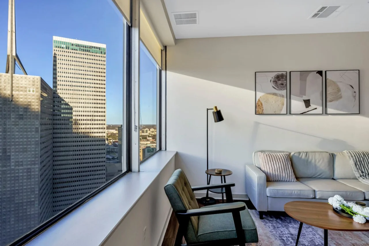 The living room is filled with natural light, creating a bright and welcoming space that invites relaxation.