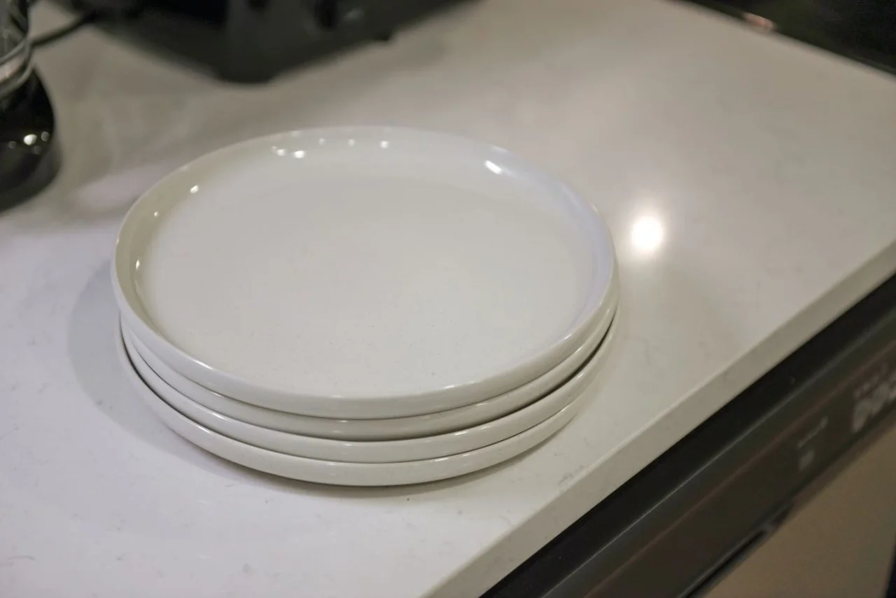 Kitchen cabinets stocked with cooking wares, glassware and silverwares, ideal for mixing up your favorite meals and drinks during your stay.