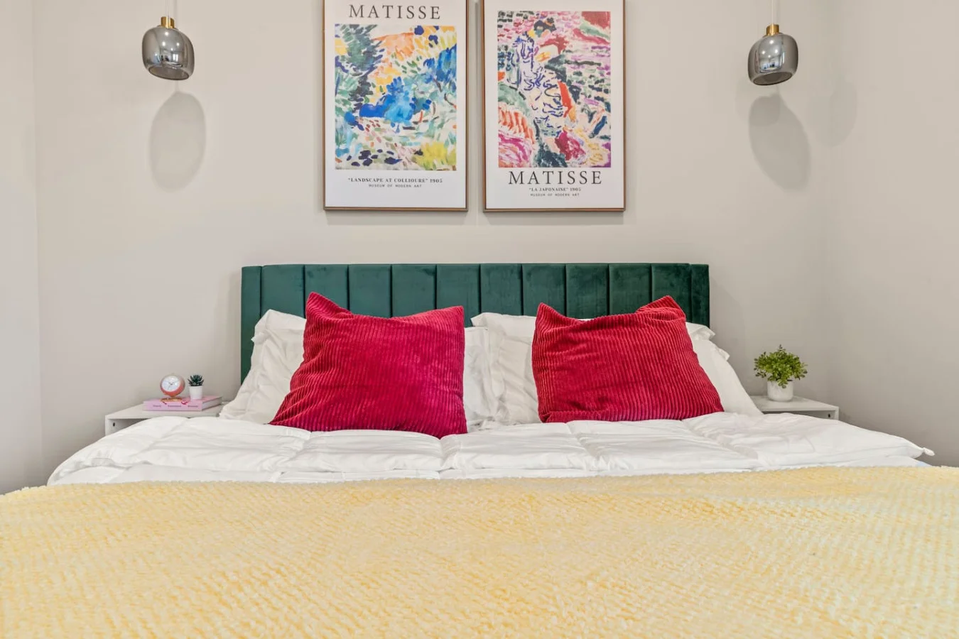 You feel enveloped in comfort as you relax on the queen bed, surrounded by a room designed for tranquility.