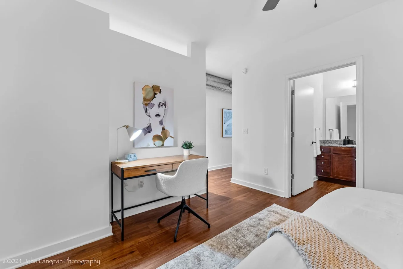 This cozy workspace in the master bedroom is perfect for productivity. Enjoy natural light, a comfortable chair, and a stylish desk setup. Ideal for work-from-home needs or planning your Dallas adventures.