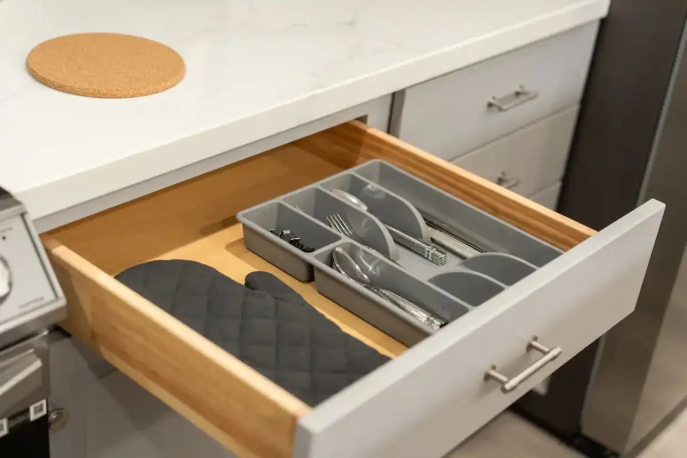 Kitchen cabinets stocked with cooking wares, glassware and silverwares, ideal for mixing up your favorite meals and drinks during your stay.
