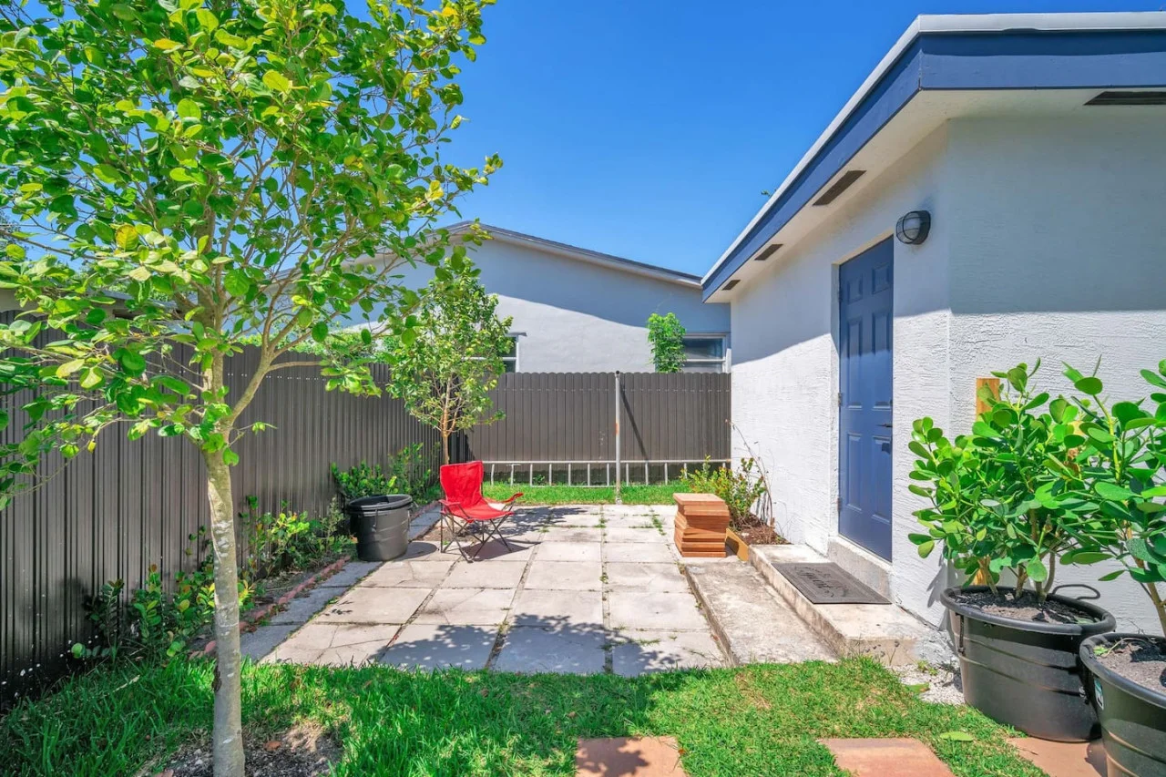 A cozy backyard area with a tiled patio.