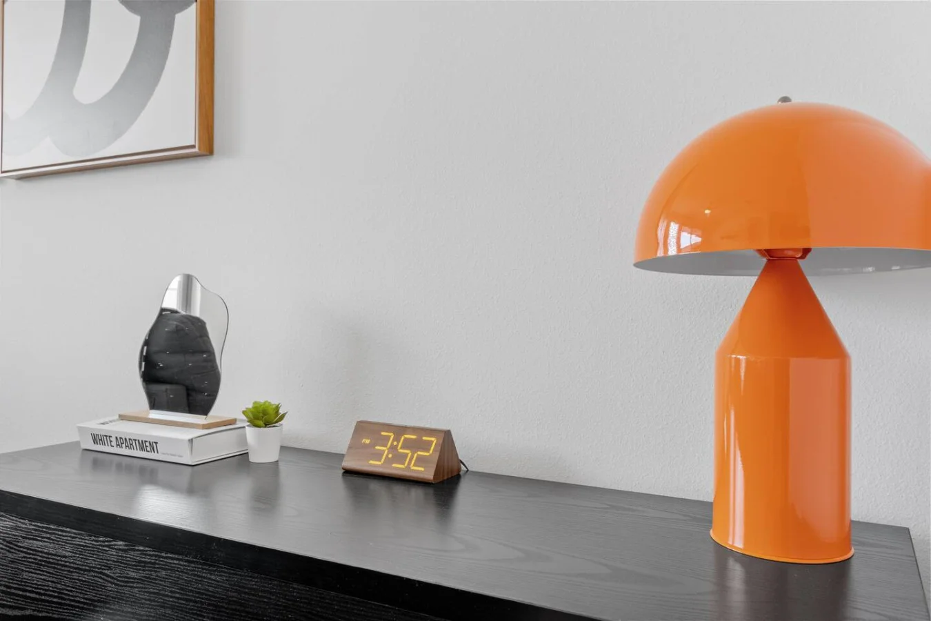 Warmly lit, inviting workspace with a stylish wall display—ideal for getting things done.