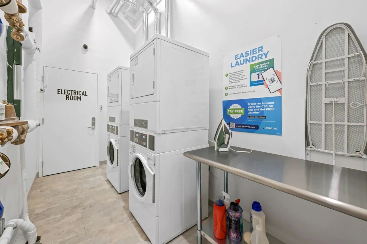 As you step into the laundry room, the modern appliances and ample storage space make it easy to keep things tidy.