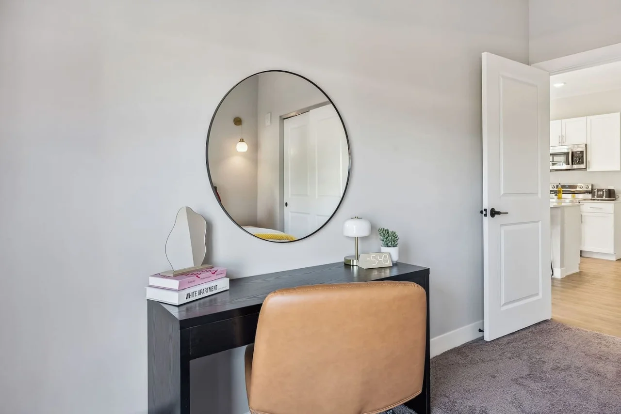 This cozy workspace with warm lighting, and a creative wall display, perfect for productivity.