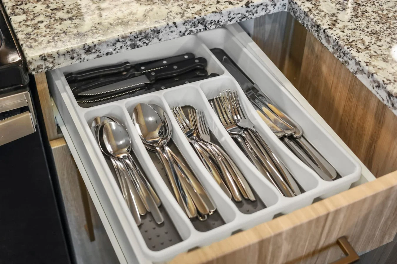 Kitchen utensils with scissors, measuring cups, grater, wine opener, can opener