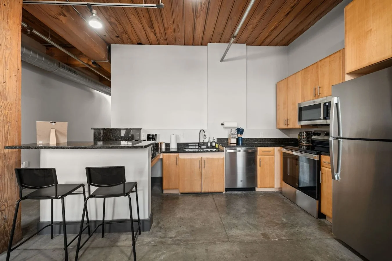 Open-concept kitchen with breakfast bar.