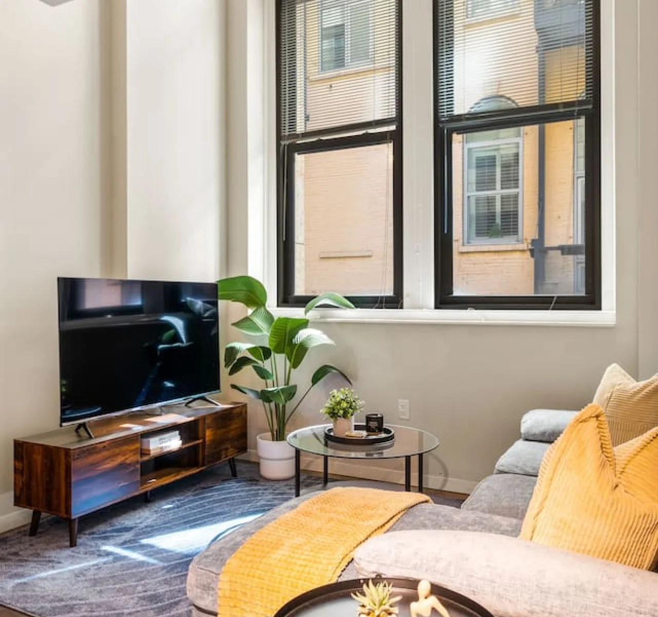 You feel a sense of peace as you step into the living room , with its inviting decor and soothing tones.