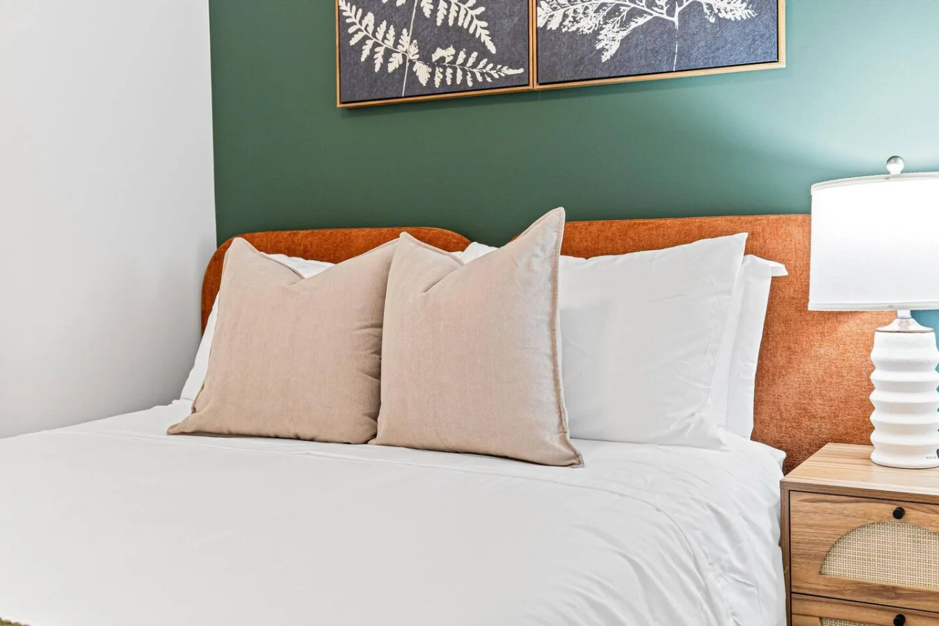 The bedroom offers a luxurious retreat, with a bed that promises restful nights and a room that feels like a private oasis.