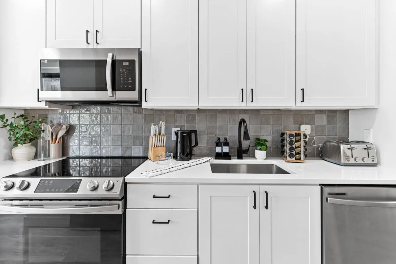 Front hallway - Fully equipped kitchen w/ Stainless steel appliances - Microwave - Dishwasher - Fridge & Freezer - Stove - Sink - Toaster - Spice rack - Kettle - Coffee maker - Knife block - Decorative accents and more.
