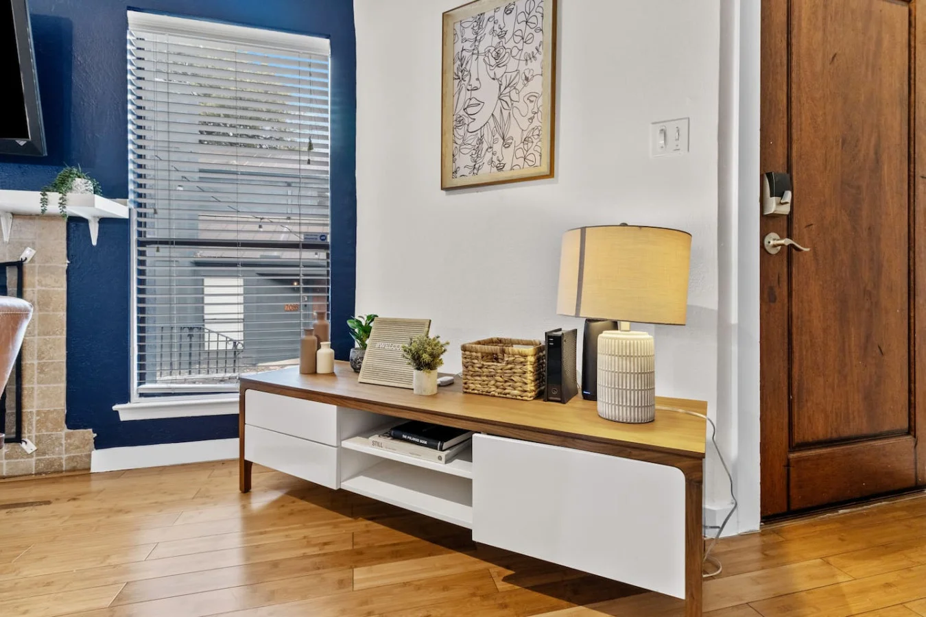 Sleek media console with warm lighting and clean design