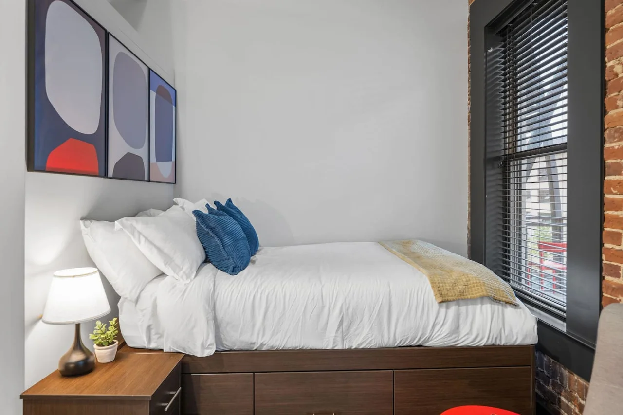 Luxurious bedroom featuring a comfortable bed, elegant decor, and plenty of natural light for a rejuvenating sleep.