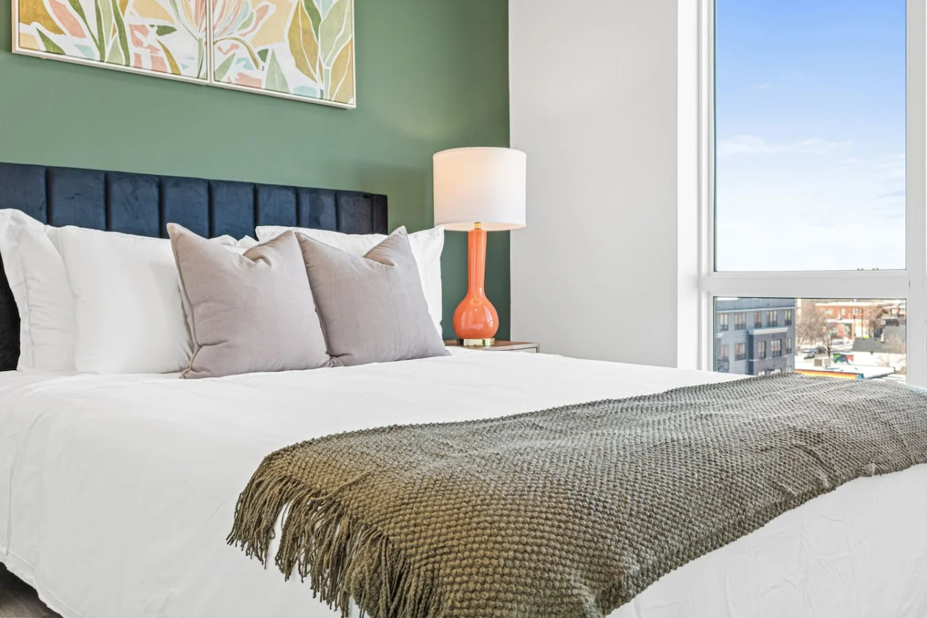 The bedroom offers a luxurious retreat, with a bed that promises restful nights and a room that feels like a private oasis.